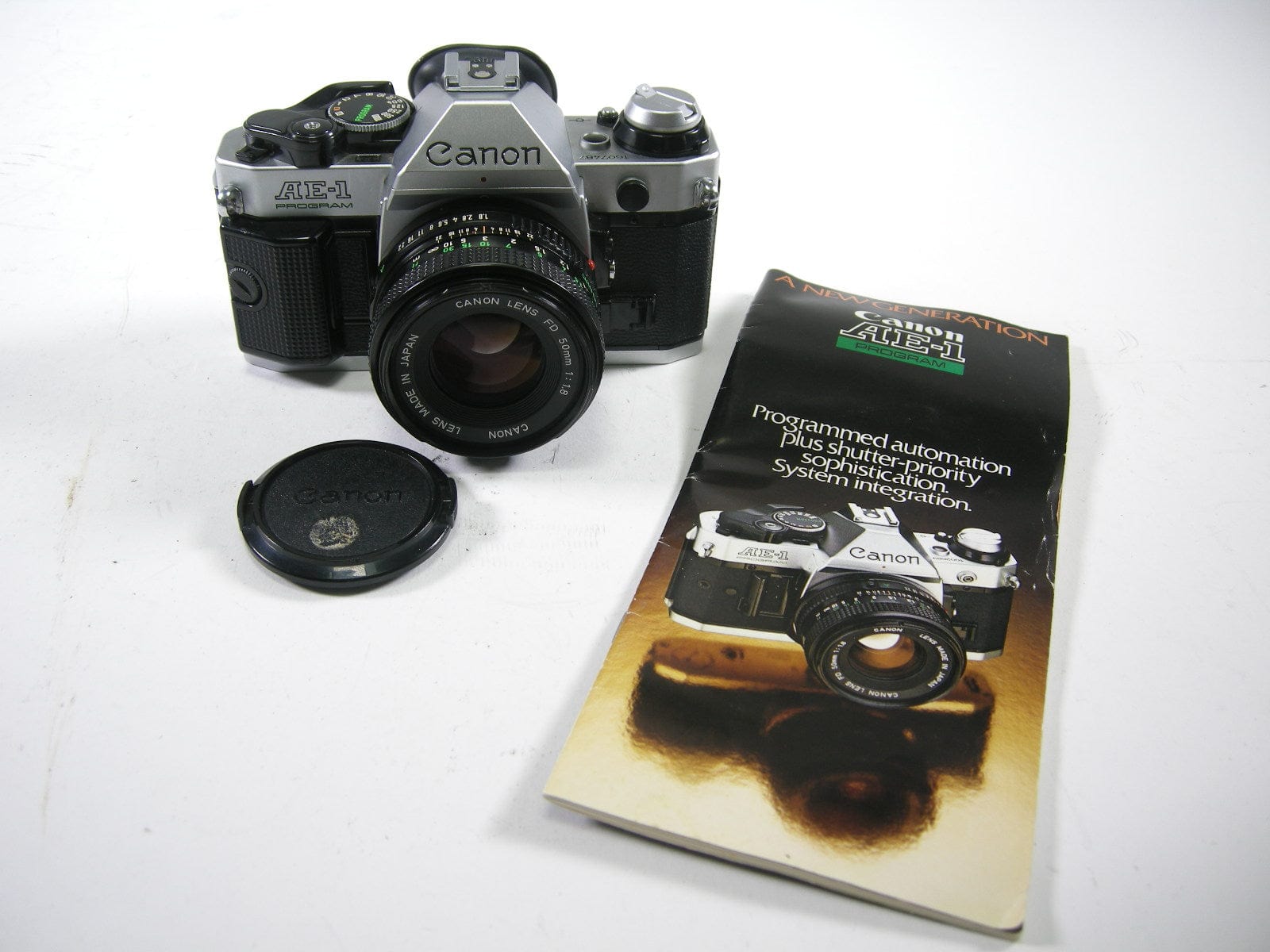 thumbnail interactive-video image 1 of Vintage Canon AE-1 Program 35mm SLR Film Camera W/ 50mm F/1.8 FD Lens – Tested & Working! 1 of 4
