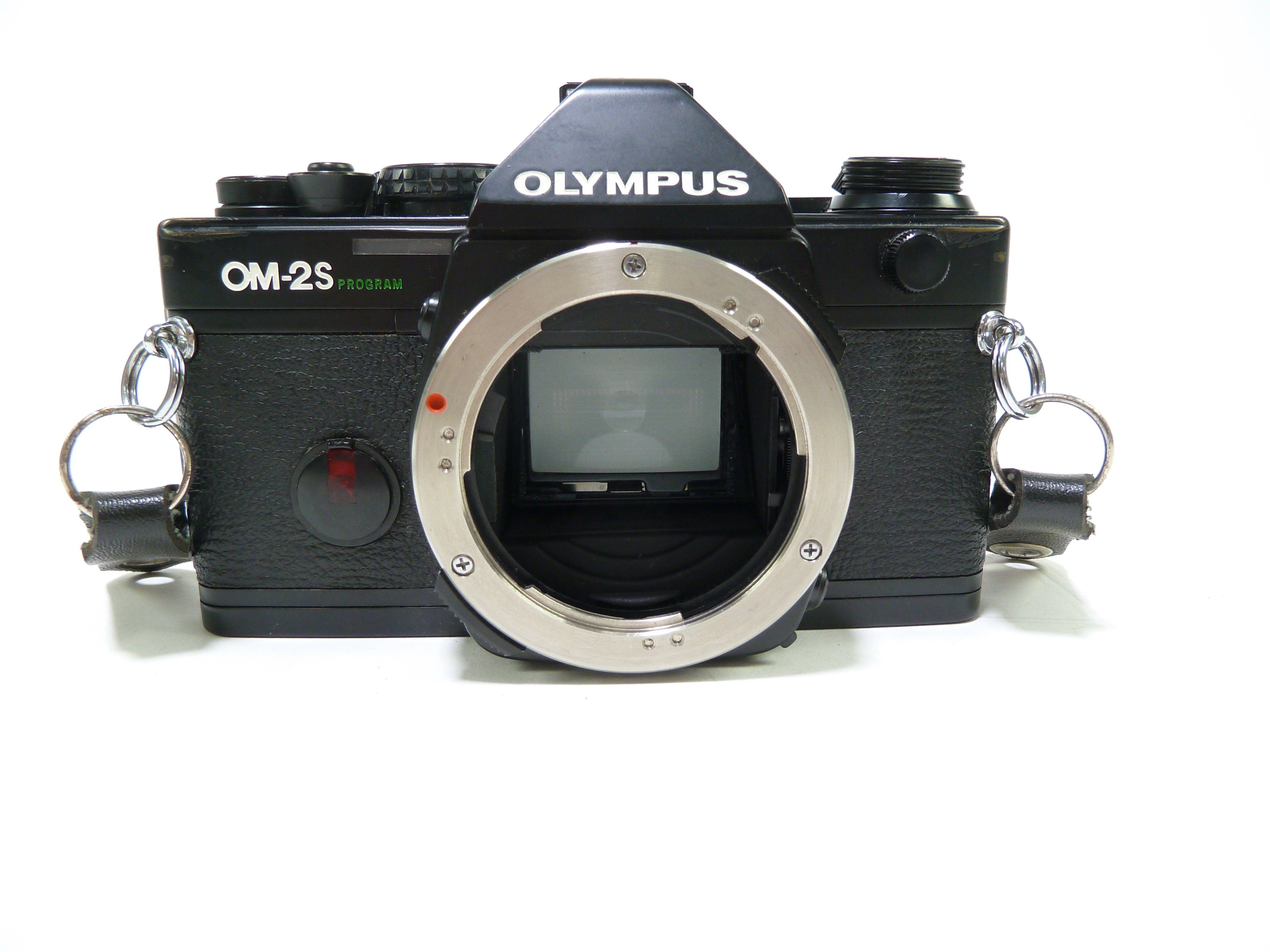 Olympus OM25 Program SLR 35mm Film Camera with an Olympus 50mm f/1.8 Leans  and an Olympus Winder 2 Grip