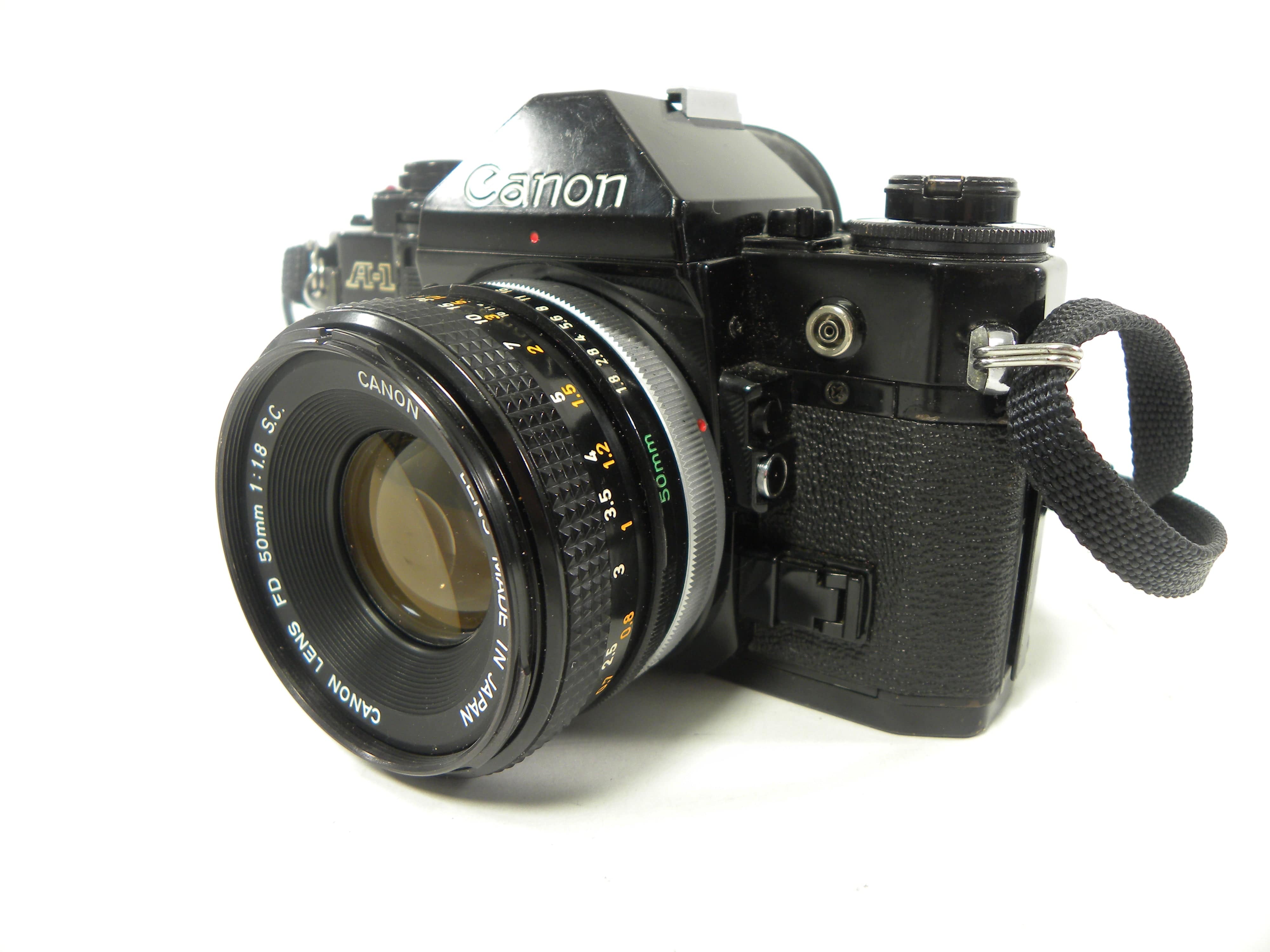 フィルムカメラ Canon A-1 + FD 50mm F1.8 + DATA BACK A フィルムカメラ Canon A-1 Black + New FD 50mm f1.8 MINT 】 CANON A