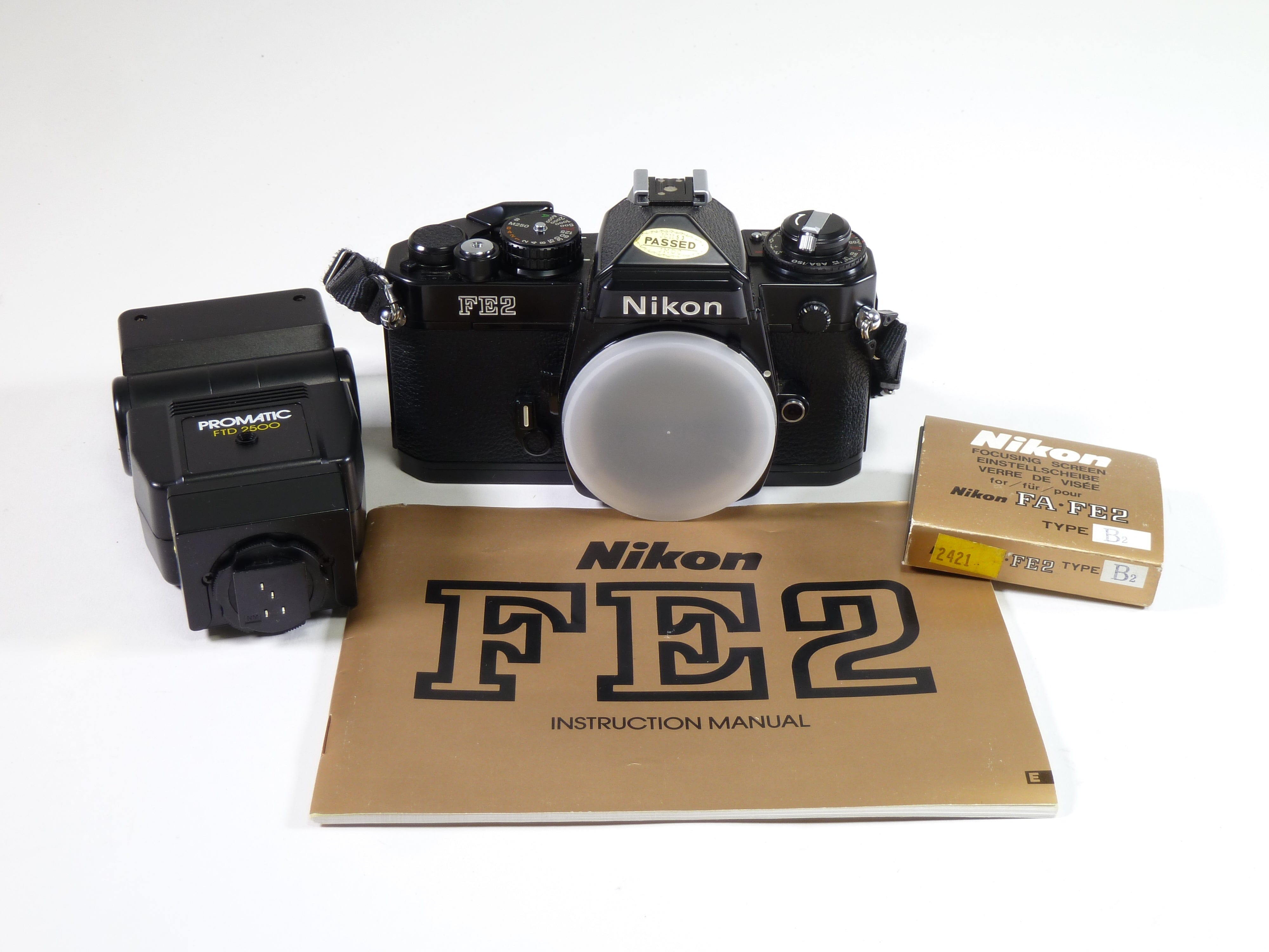 Nikon FE2 35mm film camera with FA-FE2 focusing screen and Promatic fl ...